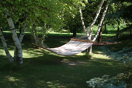 white hammock hang on trees thumbnail