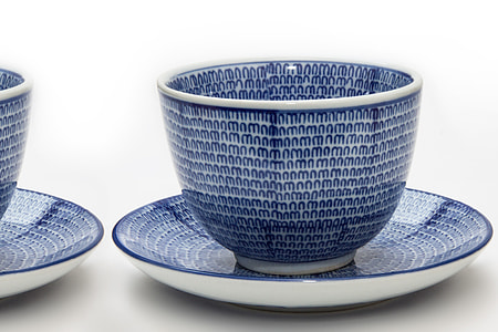 blue and white ceramic teacup on top of saucer thumbnail