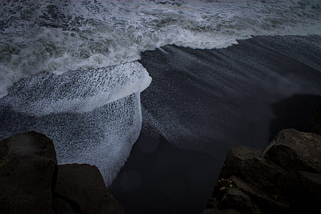 rocks on seashore with wavy sea thumbnail