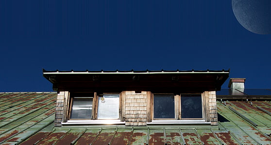 gray concrete building under blue sky thumbnail