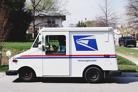 parked USPS vehicle near house thumbnail