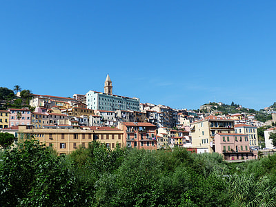 assorted-color concrete buildings under clear blue sky thumbnail