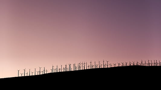 silhouette photo of windmills thumbnail