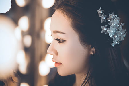 woman in white headpiece thumbnail