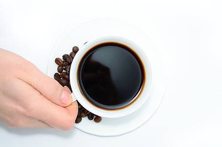 person holding white cup thumbnail