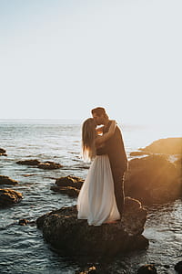 couple kissing on rock thumbnail