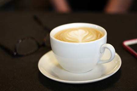 selective focus photography of coffee latte thumbnail
