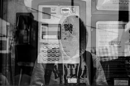 grayscale photo of telephone booth thumbnail