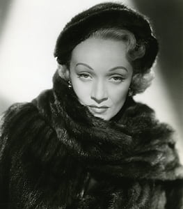 grayscale photo of a woman wearing fur coat thumbnail