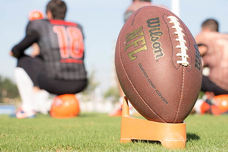 Wilson football on orange rack thumbnail