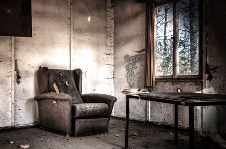 black suede armchair near clear glass window thumbnail