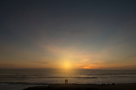 two person near seashore during golden hour thumbnail