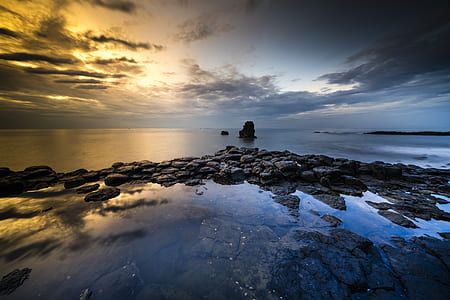 timelapse photography of body of water thumbnail