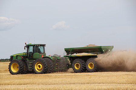 green tractor under blue sky thumbnail