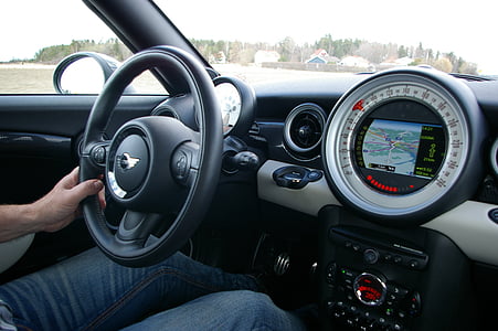 person driving Mini vehicle during daytime thumbnail