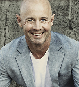 man wearing gray blazer with white crew-neck shirt thumbnail