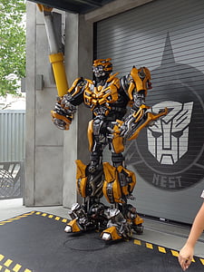 Transformers Bumblebee statue in front of gray roller shutter thumbnail