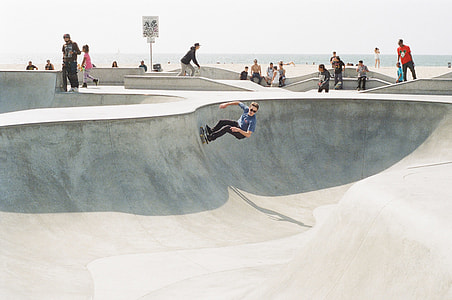 group of skaters playing on ramps during daytoime thumbnail