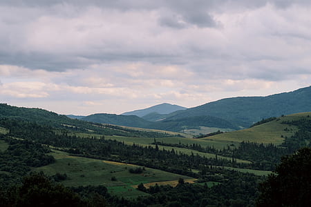 landscape photography of green highlands thumbnail