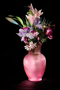 purple and pink flowers in pink vase thumbnail