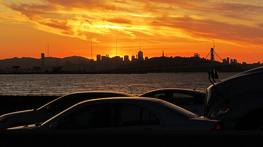 Sunset over the skyline and cars in San Francisco, California thumbnail