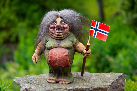 witch holding red and black flag figurine thumbnail