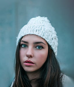 selective focus photography of woman in white knit cap thumbnail