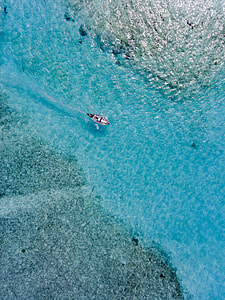 aerial photo of boat on body of water thumbnail