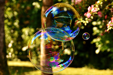 selective focus photography of three bubbles during day time thumbnail