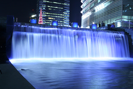 waterfalls near buildings thumbnail