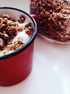 black and red plastic container with brown peanuts thumbnail
