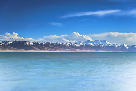 alps mountain near body of water thumbnail