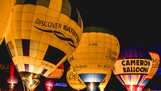multicolored hot air balloons at nighttime thumbnail