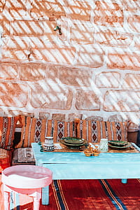 plates on teal coffee table thumbnail