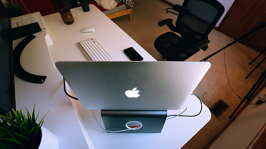 silver MacBook on table thumbnail