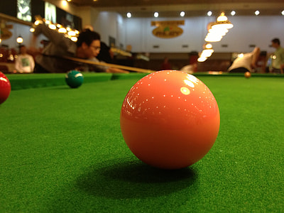 pink billiard ball on billiard table thumbnail