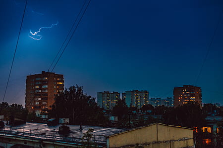 lightning over concrete buildings thumbnail