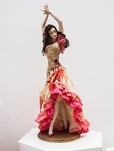 woman in red and brown floral ruffle dress figurine thumbnail