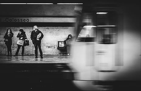 grayscale photography of people waiting in subway thumbnail