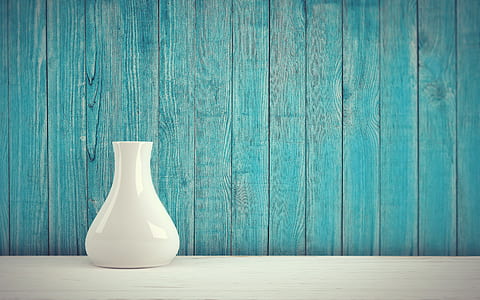 white ceramic vase on white surface thumbnail