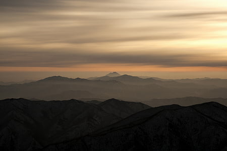 silhouette photo of mountains during golden hour thumbnail