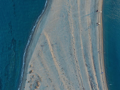 people on white stand between blue sea thumbnail