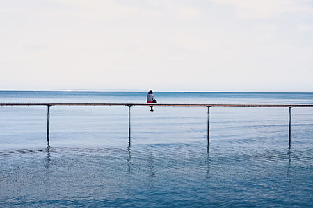person in dock during daytime thumbnail