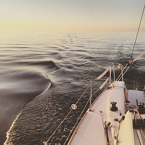 low angle photography of white boat on body of water thumbnail