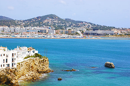white building beside sea thumbnail
