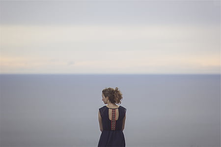 woman looking at her side thumbnail