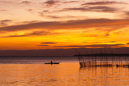 person riding boat on body of water thumbnail