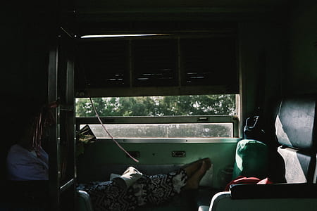 woman lean on chair beside open door thumbnail
