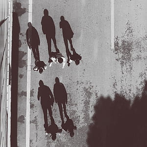 five persons standing on road top-view photography thumbnail