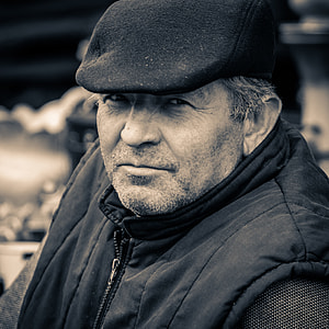 grayscale photography of man in zip-up jacket thumbnail